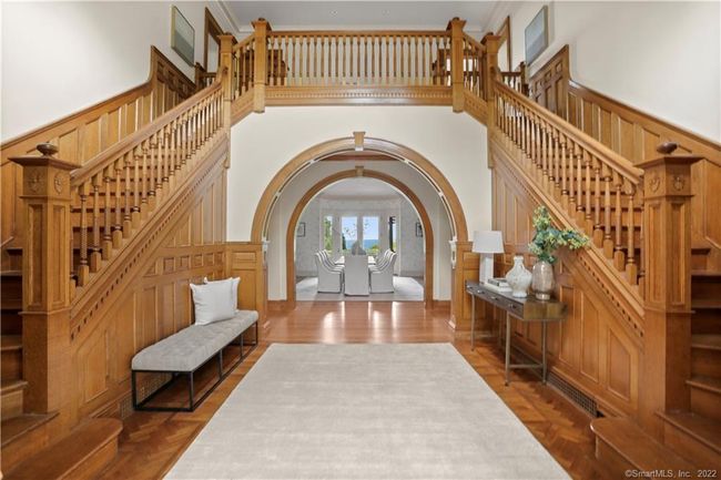 AWARD WINNING AIA FOYER // Award winning foyer with double stairway of quarter sawn oak, turned balustrade, oak paneling, arch and flooring with herringbone pattern. | Image 33