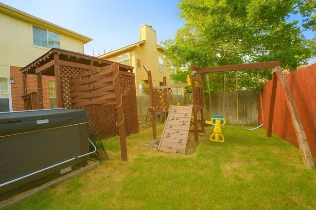 Fenced backyard with a playground | Image 22