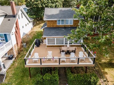 Rear view of property featuring a deck and central AC | Image 2