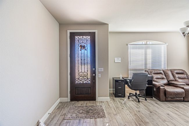 Entryway featuring light wood-style floors and baseboards | Image 5