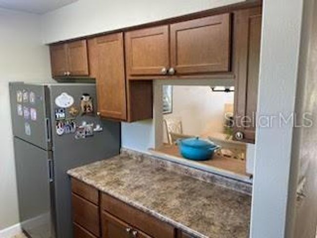 Kitchen with opening to dining room | Image 4