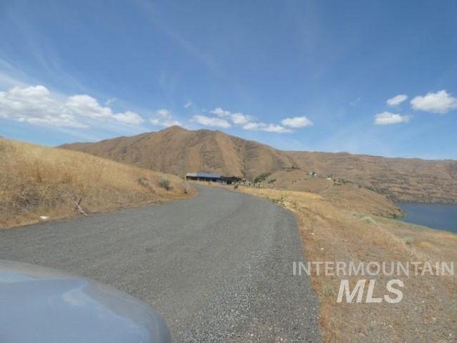 View of asphalt street featuring a mountain view | Image 21