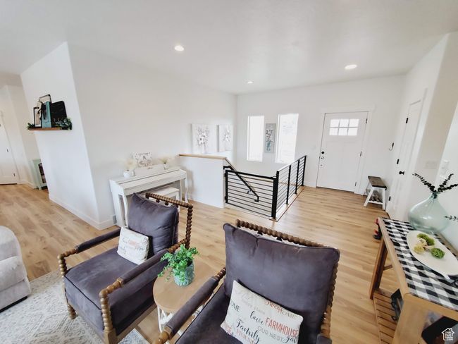 Living room featuring baseboards, recessed lighting, and light wood-style floors | Image 4