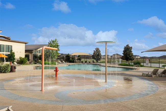 Community pool with a patio area | Image 19