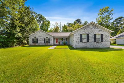 Single story home featuring a front yard | Image 1