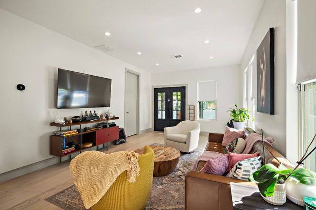 Living room featuring light wood-style floors, visible vents, and recessed lighting | Image 5