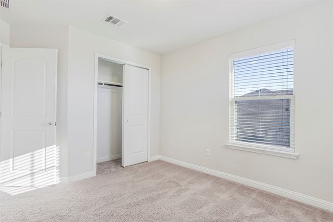 Unfurnished bedroom featuring carpet flooring and a closet | Image 31