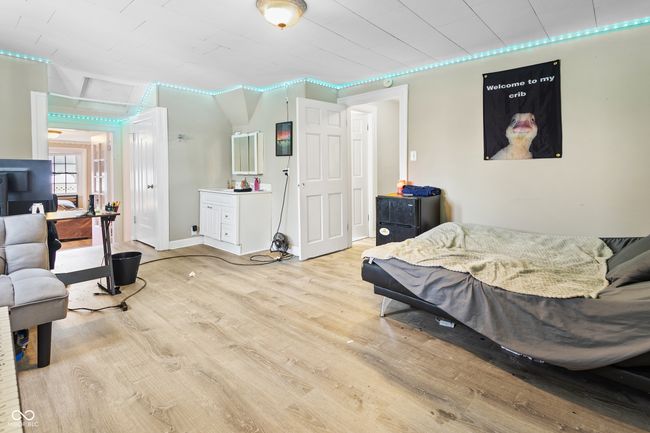 bedroom with wood finished floors | Image 10