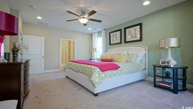 Carpeted bedroom with baseboards, recessed lighting, ceiling fan, and ensuite bath | Image 21