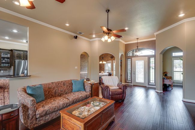 Living room, hardwood floors, dual ceiling fans | Image 7