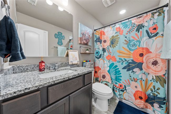 Bathroom with vanity, toilet, a shower with curtain, and recessed lighting | Image 7
