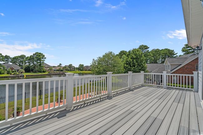 Wooden deck featuring a water view and a residential view | Image 32
