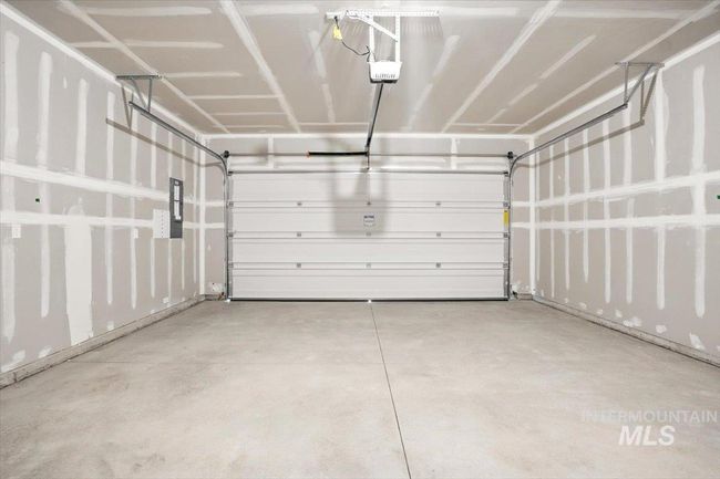 Garage with a garage door opener | Image 26