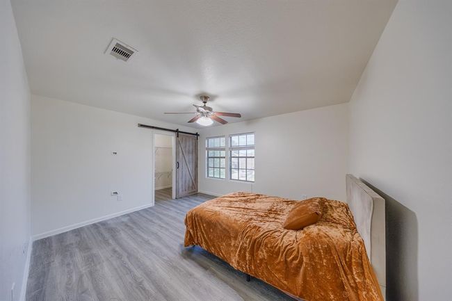 Upstairs bedroom #2 includes a spacious walk-in closet for convenient storage and organization. | Image 28