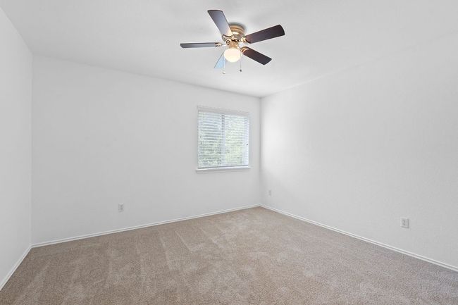 Empty room featuring ceiling fan, carpet floors, and baseboards | Image 24