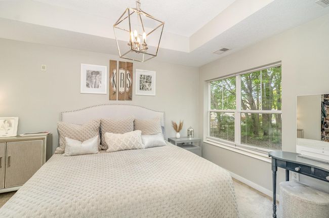 Beautiful primary suite with stunning chandelier | Image 11