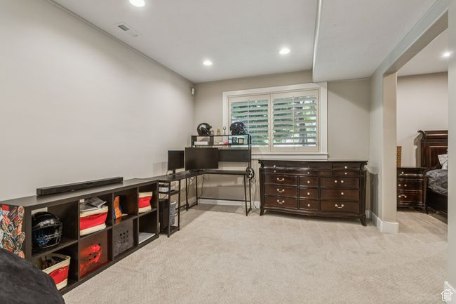 Playroom featuring carpet flooring, recessed lighting, and an office area | Image 58