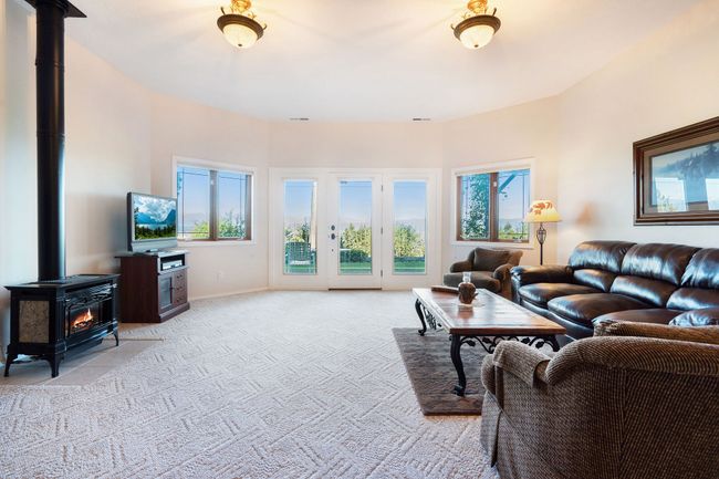 Lower level living area with access to patio | Image 29