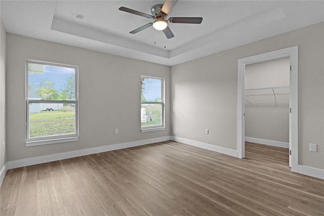 Primary bedroom with tray ceiling | Image 21