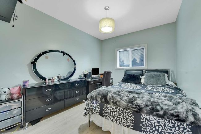 Bedroom featuring wood finished floors | Image 35