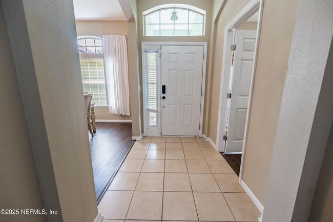 11760 Huckleberry Trl E, House other with 4 bedrooms, 2 bathrooms and null parking in MACCLENNY FL | Image 6