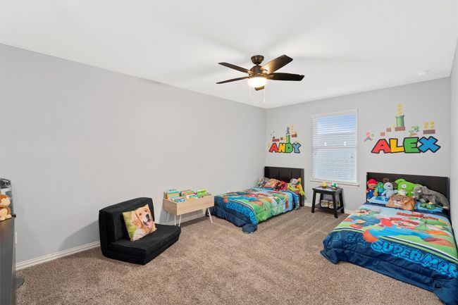 Bedroom with carpet floors and a ceiling fan | Image 29