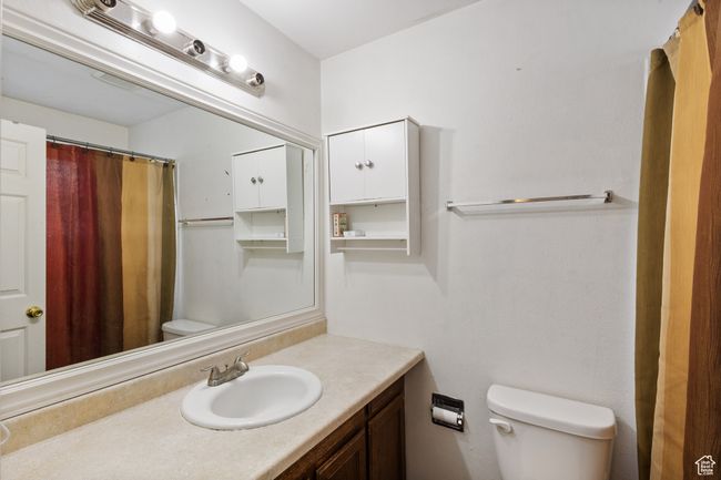 Bathroom featuring vanity and a shower with shower curtain | Image 10