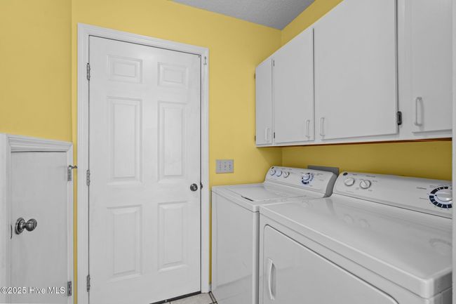 Laundry Room with additional unfinished storage behind the door on the left. | Image 13