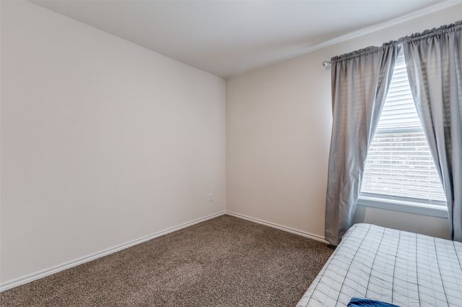 Unfurnished bedroom with carpet floors and baseboards | Image 16