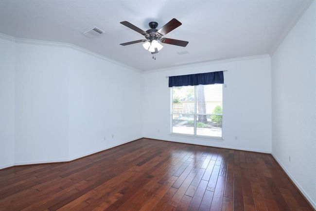 Primary bedroom with crown molding. | Image 18