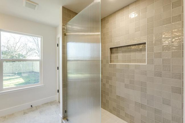Full bathroom with tile patterned flooring, walk in shower, visible vents, and baseboards | Image 8