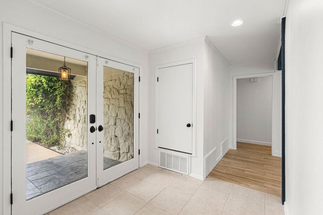 Tiled entryway featuring crown molding and recessed lighting | Image 5