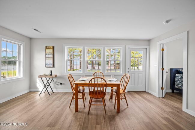 Large bright windows let in light and gorgeous water views all the way around! | Image 8