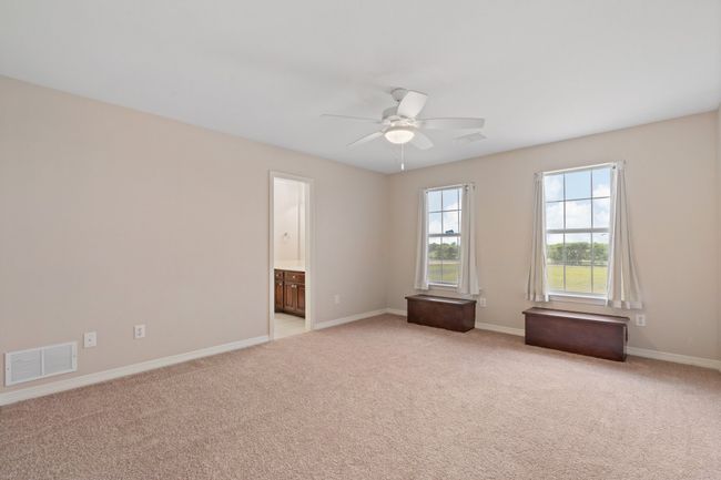 Upstairs bedroom 2, natural light, new carpet and door to private bath. | Image 31
