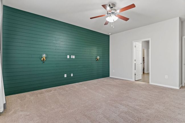 Empty room featuring carpet, baseboards, and ceiling fan | Image 23