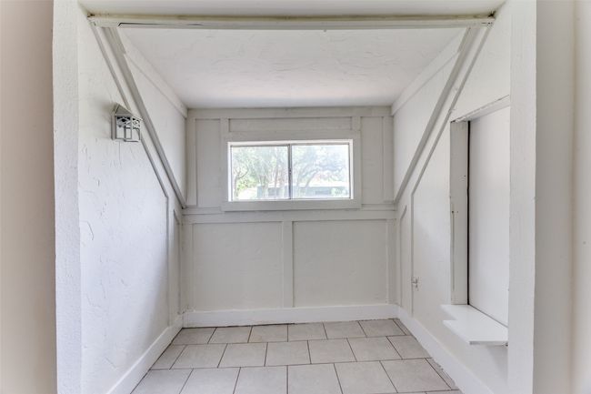 View of unfurnished sunroom | Image 10