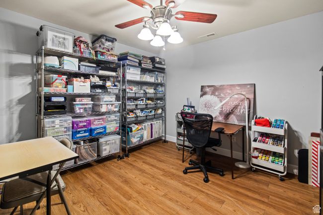 Office area featuring ceiling fan and wood-type flooring | Image 76