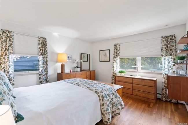 First floor bedroom with wood floors | Image 12
