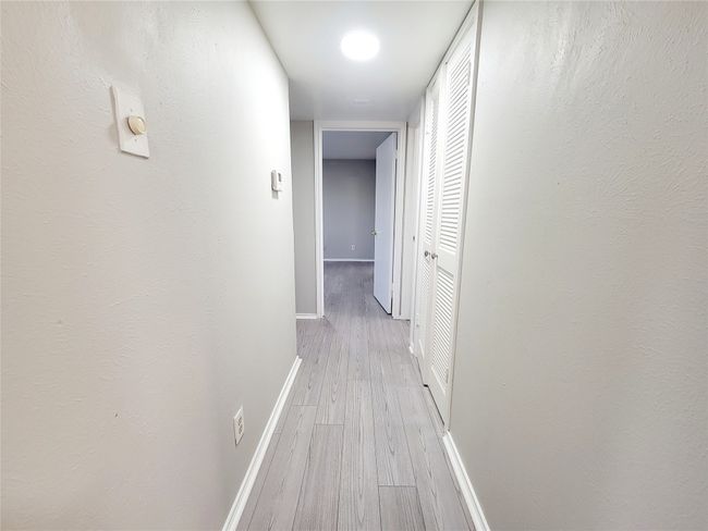 Corridor with light hardwood / wood-style flooring | Image 10