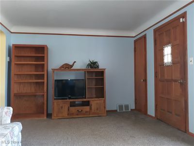 Carpeted living room with natural woodwork | Image 3