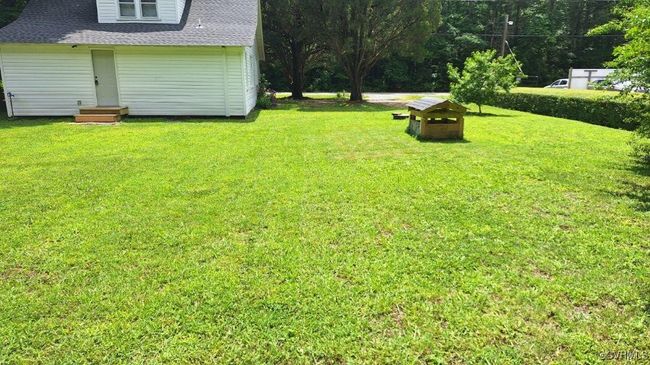 View of green lawn featuring entry steps | Image 49