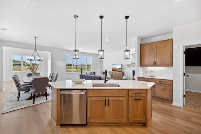 Kitchen opens up to dining area, family room and the gorgeous morning room! | Image 7