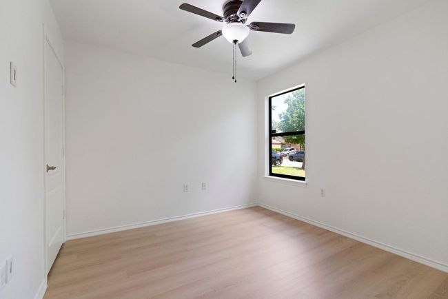 This room could easily double as an office, hobby room or home gym. | Image 17