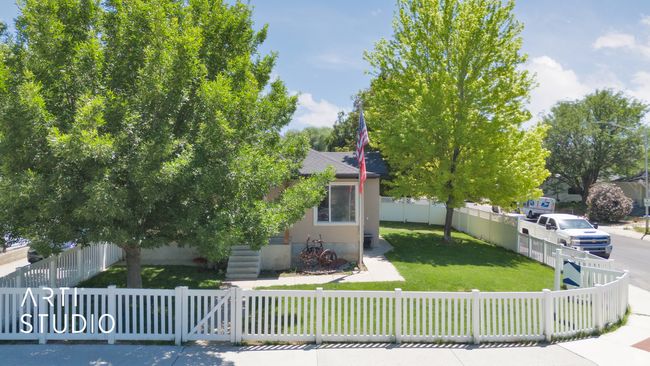 Obstructed view of property with a shingled roof | Image 32