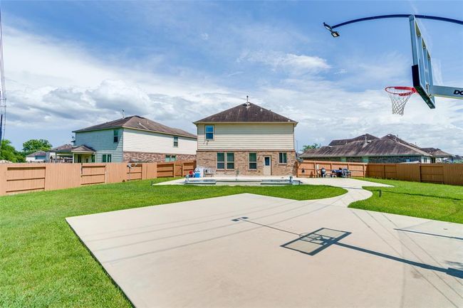 This home features a private pool and a basketball court, perfect for outdoor fun and entertaining. | Image 17