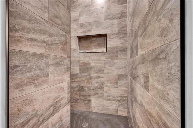 Detailed view of tiled shower | Image 32
