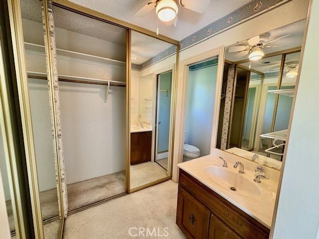 Primary bathroom has privacy door to toilet and shower area | Image 33