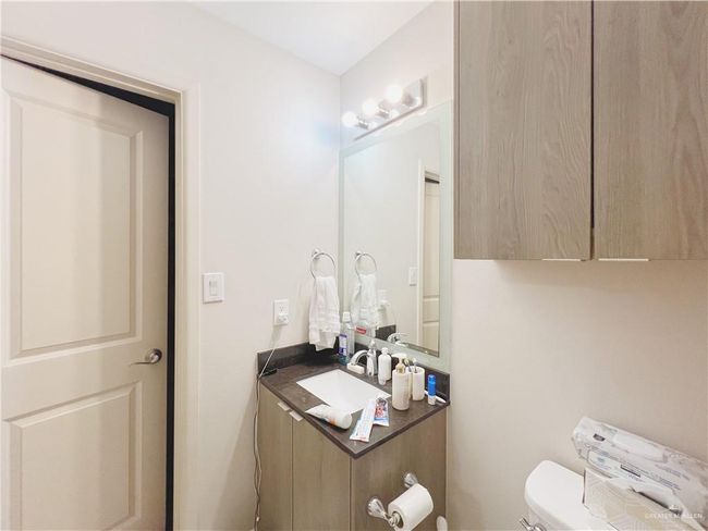 Bathroom with toilet and vanity | Image 7