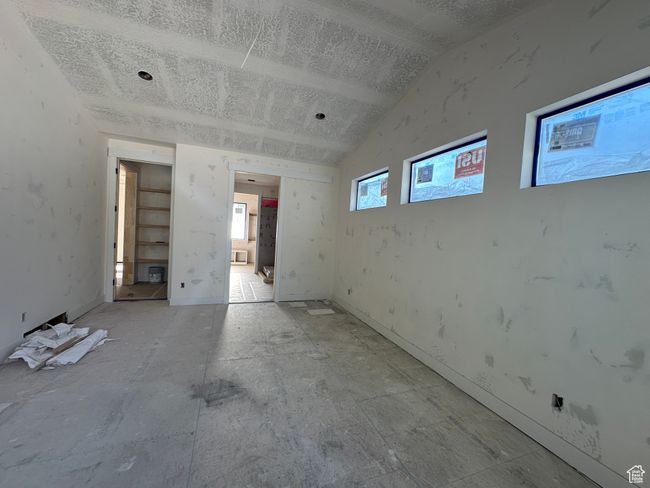 Spare room with vaulted ceiling and a textured ceiling | Image 24
