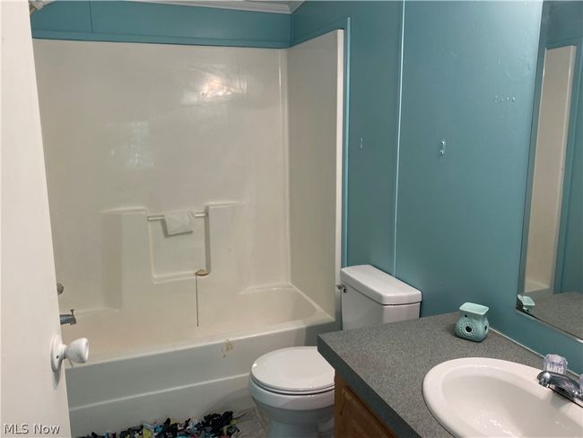 Full bathroom with vanity, toilet, and bathtub / shower combination | Image 8